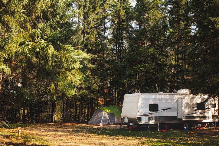 An RV camping in the woods